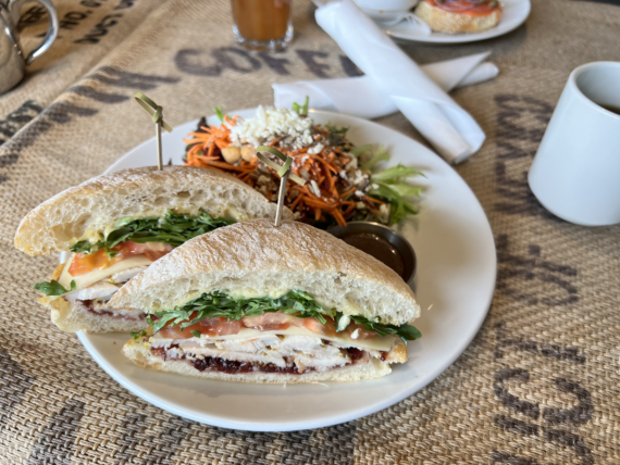 Estevan 2.0 Sandwich- sliced chicken breast, Swiss cheese, arugula, tomato, aioli and cranberry relish on a ciabatta bun