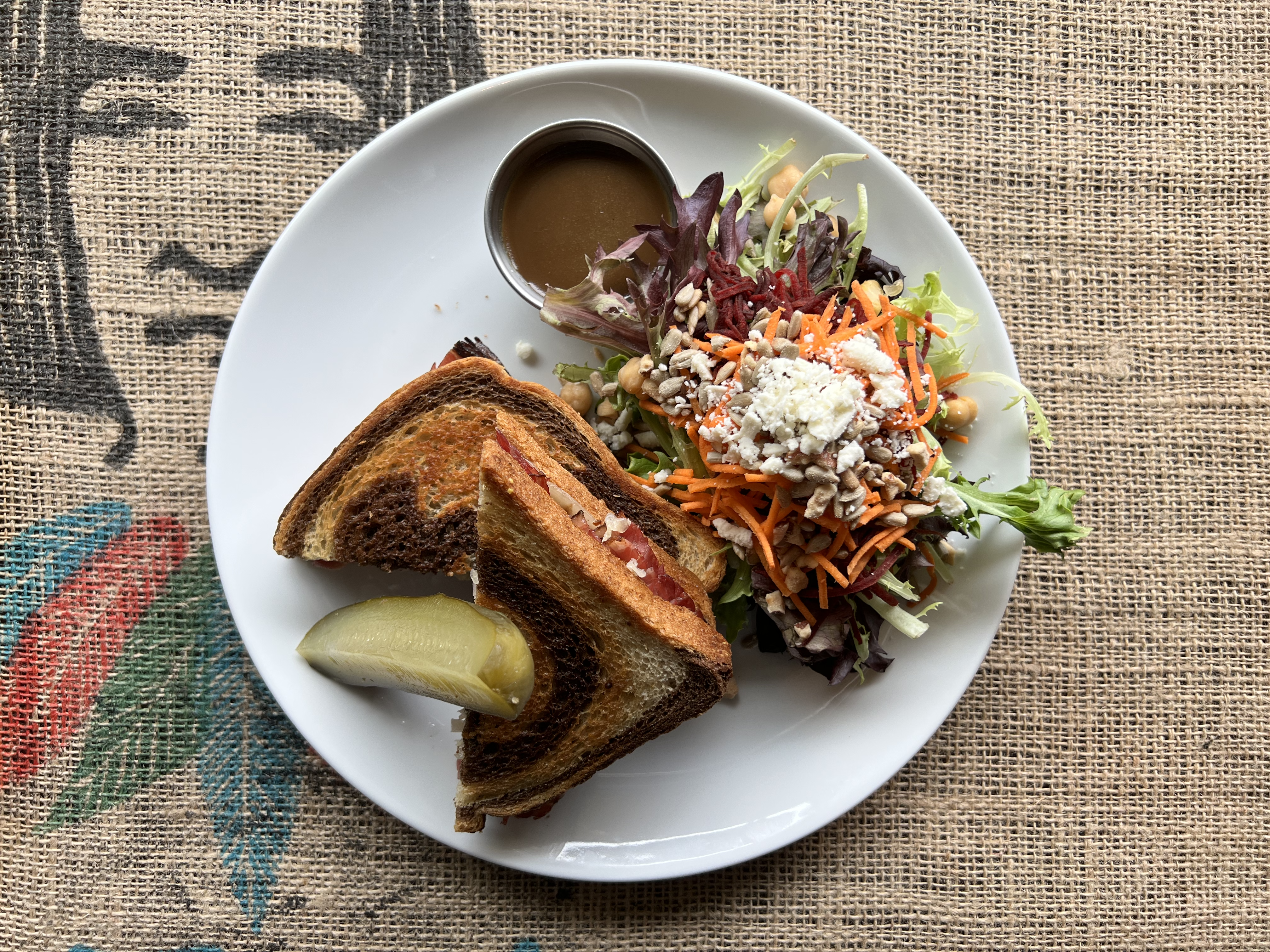 Reuben - smoked meat, sauerkraut, swiss & grainy dijon mustard on marble rye, kosher pickle
